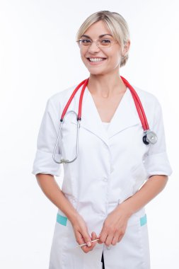 Beautiful healthy female general practitioner is working