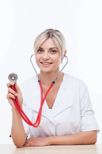 Cheerful young female doctor is serving the patient — Stock Fotó