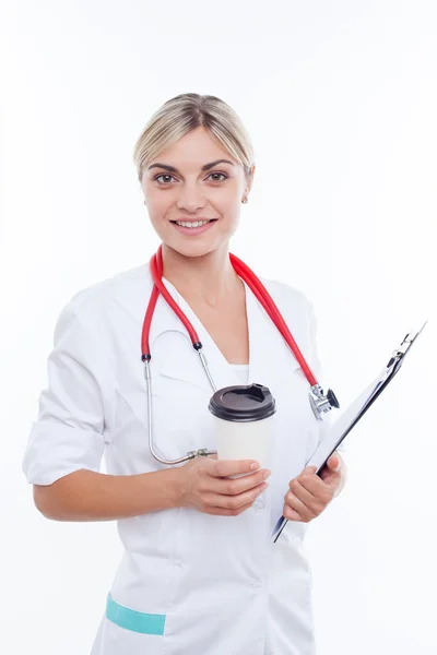 Beautiful young female physician is enjoying hot drink — Stok fotoğraf