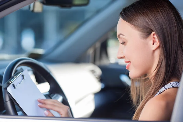 Attractive young woman is driving her personal transport — Stock Photo, Image