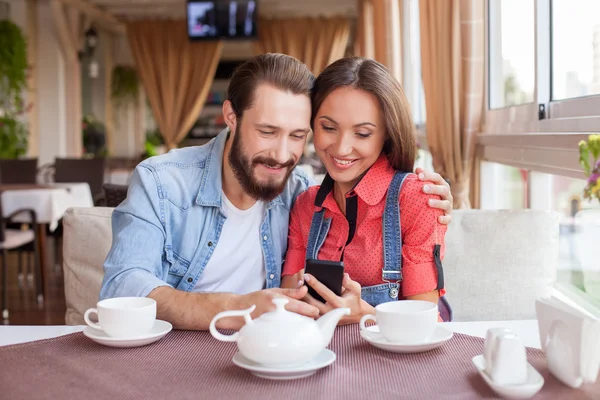 Beautiful loving couple is dating in cafe — Stock Photo, Image