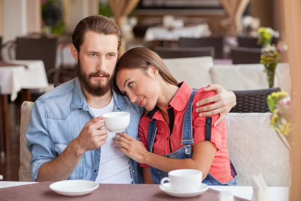 Pretty young loving couple is resting in cafe — Φωτογραφία Αρχείου