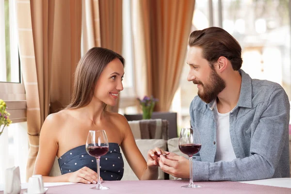 Attractive young loving couple is celebrating in restaurant — Φωτογραφία Αρχείου