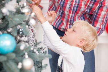 Cute man and child are preparing for New Year