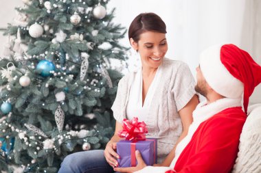 Cheerful married couple is celebrating New Year