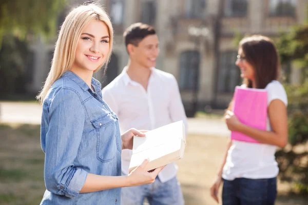 Attractive young students are studying near their institute — Stock Fotó