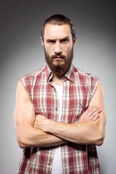 Attractive young man with beard is serious — 图库照片