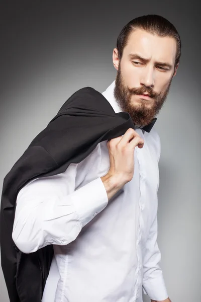 Joven hombre de negocios guapo con barba siente tristeza —  Fotos de Stock