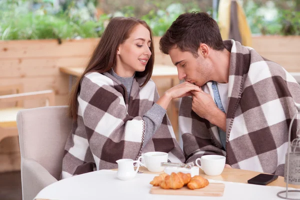 Beautiful loving couple is dating in cafeteria — Stockfoto