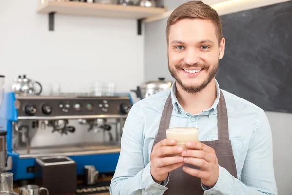 Attractive male owner of coffee shop is working — Stock Photo, Image