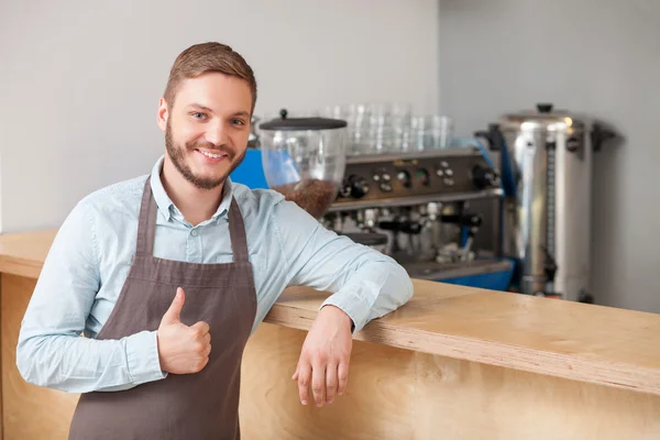 Cheerful male cafe worker is expressing positive emotions — Stock Photo, Image