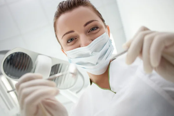 Cheerful female dental doctor is working in her office — Stockfoto