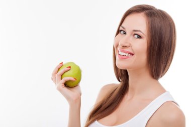Cheerful young woman prefers healthy fresh food