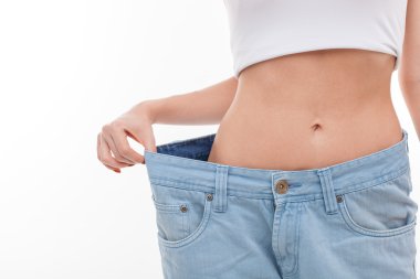 Fit young healthy woman is dieting successfully