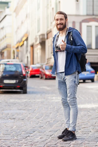 Handsome bearded man is making journey across city — Stock Fotó