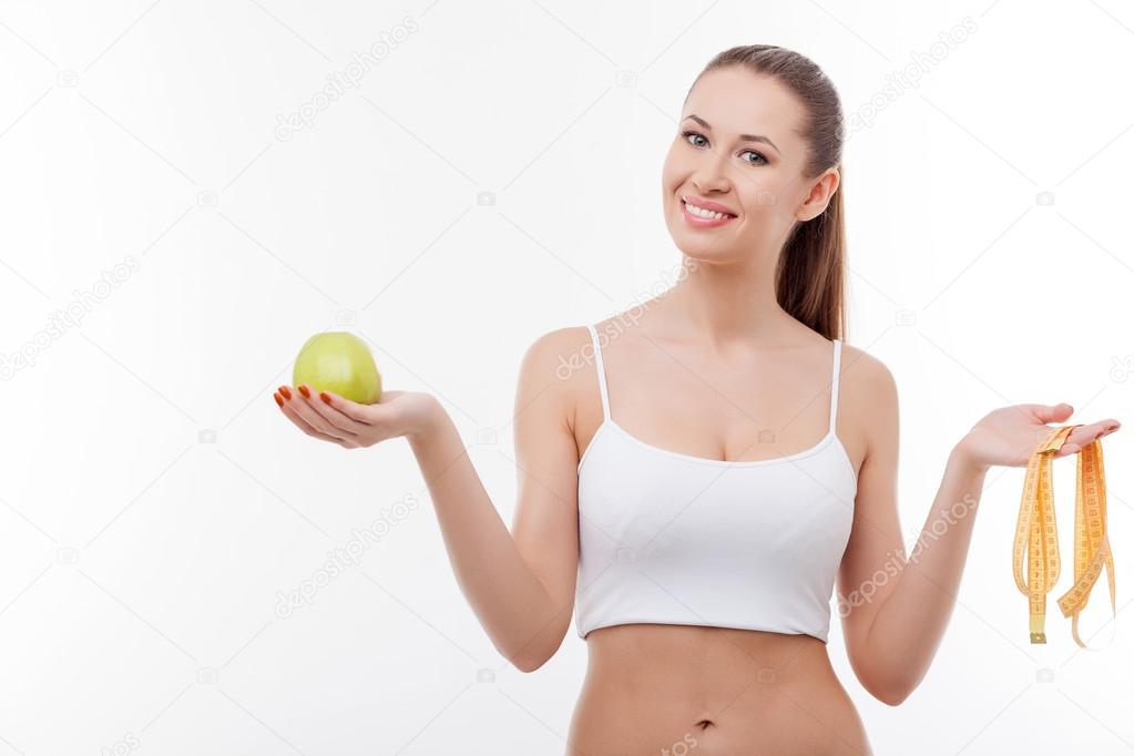 Attractive young fit girl is dieting successfully