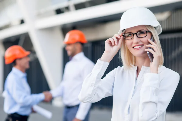 Cheerful builders are working on new project — Stock Photo, Image