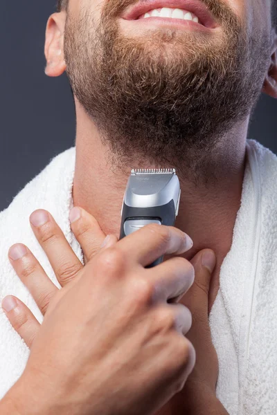 Cute bearded guy is changing his appearance — Stock Fotó