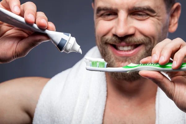 Process of toothbrushing for guy in the morning — Stock Photo, Image