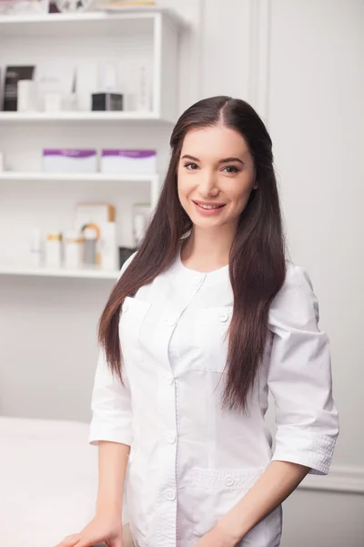 Cheerful female cosmetologist is working in her office — 스톡 사진