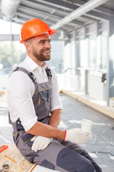 Cheerful male carpenter is getting some rest — Stock Photo, Image