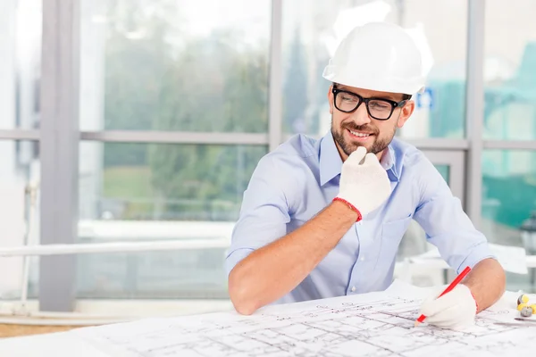 Attractive male architect is working on the project