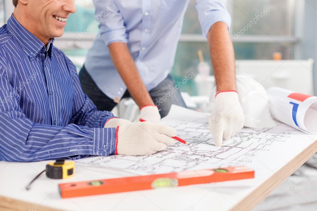 Experienced male architects are working on new construction