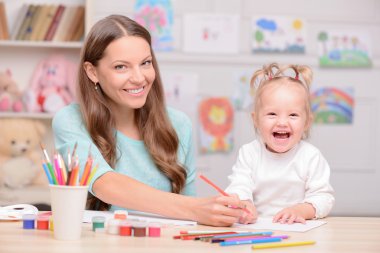 Cheerful woman is spending time with her child