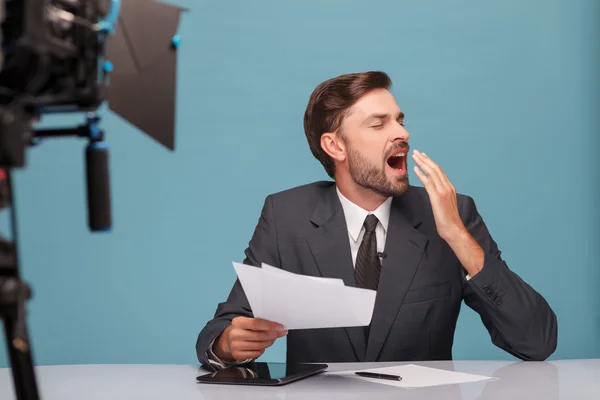 Attractive young newscaster is showing his exhaustion — Φωτογραφία Αρχείου