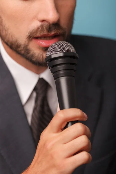 Cheerful male reporter is telling some news — 스톡 사진