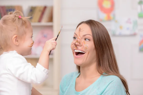 Cheerful friendly family is making fun together — Stok fotoğraf