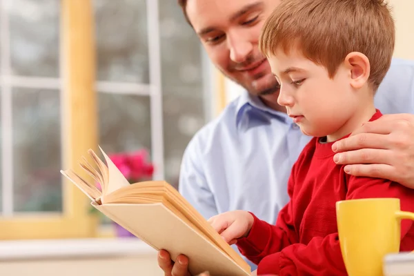 Cheerful male parent is teaching his child — Stock Photo, Image