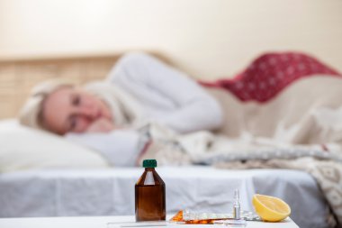 Ill young lady is suffering from cold