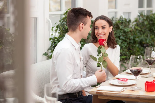 Cheerful loving couple is dating in cafe — Stok fotoğraf