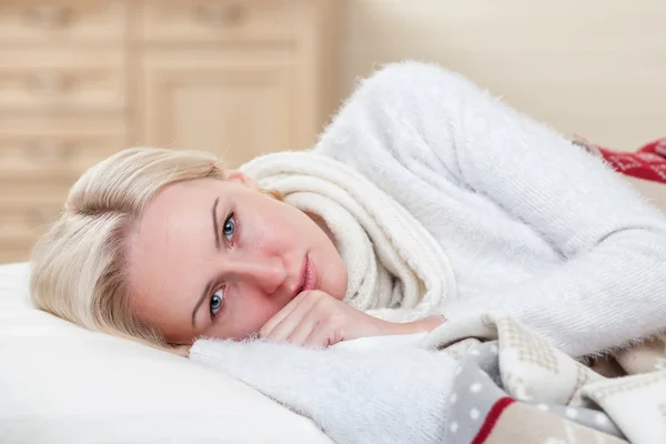 Pretty sick girl is resting at home — Stockfoto