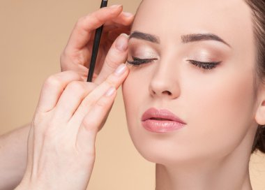 Experienced beautician is working at beauty salon