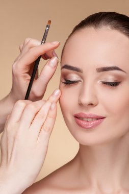 Cheerful female model is visiting beautician at salon