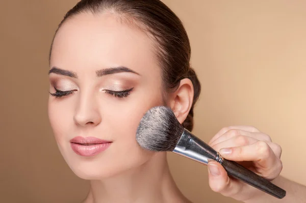 Skillful young beautician is serving her customer — Stok fotoğraf