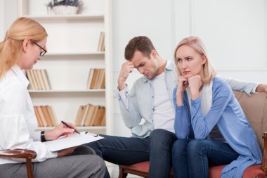 Professional female therapist is serving married couple