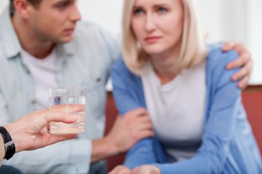 Young husband and wife are consulting marriage therapist
