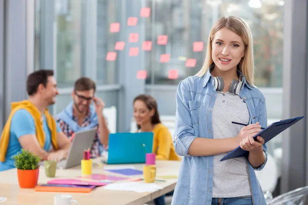 Cheerful four office workers are discussing project — Stock Fotó