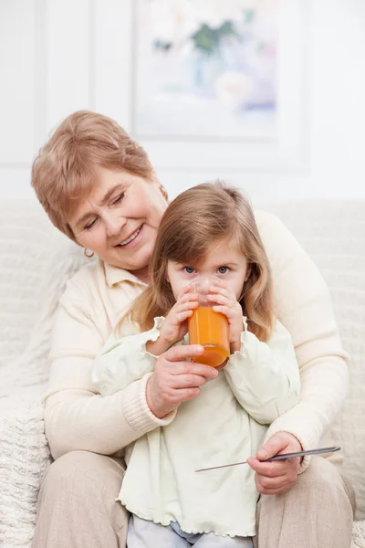 Pretty grandparent is taking care of child — 图库照片