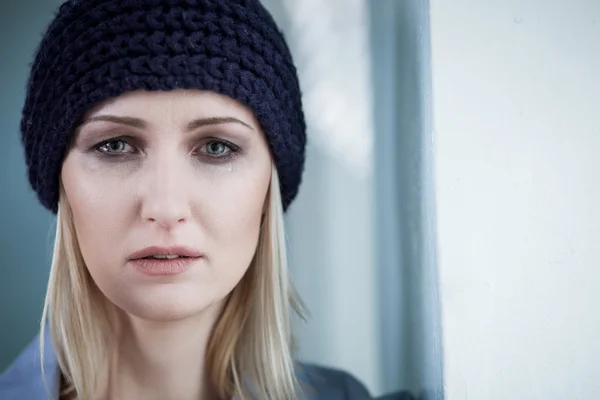 Depressed blond female druggie is weeping for loneliness — Stockfoto