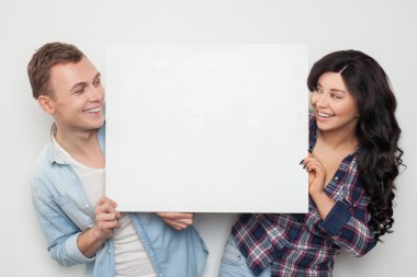Cheerful loving couple is announcing great news