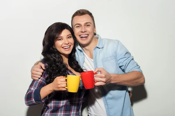 Cheerful two friends are enjoying hot drink — Stock Photo, Image
