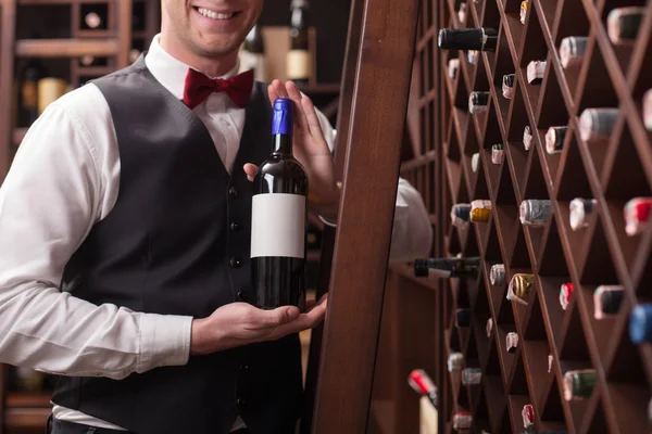 Cheerful male waiter is working in winehouse — ストック写真