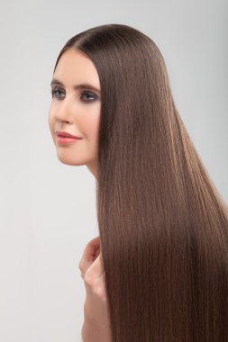 Cute woman is showing her beautiful hair