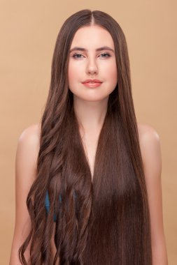 Cheerful young woman with interesting cute hairstyle