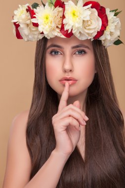 Cheerful healthy girl is asking for silence