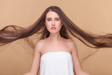 Strong wind blows on female hairstyle